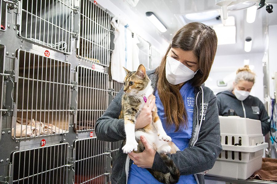 Dr. Hannah Donnelly holding a Spay Waggin' client